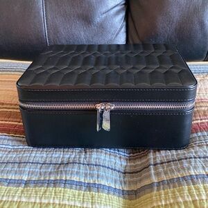Jewelry Case NIB black with several departments to organize your jewelry.